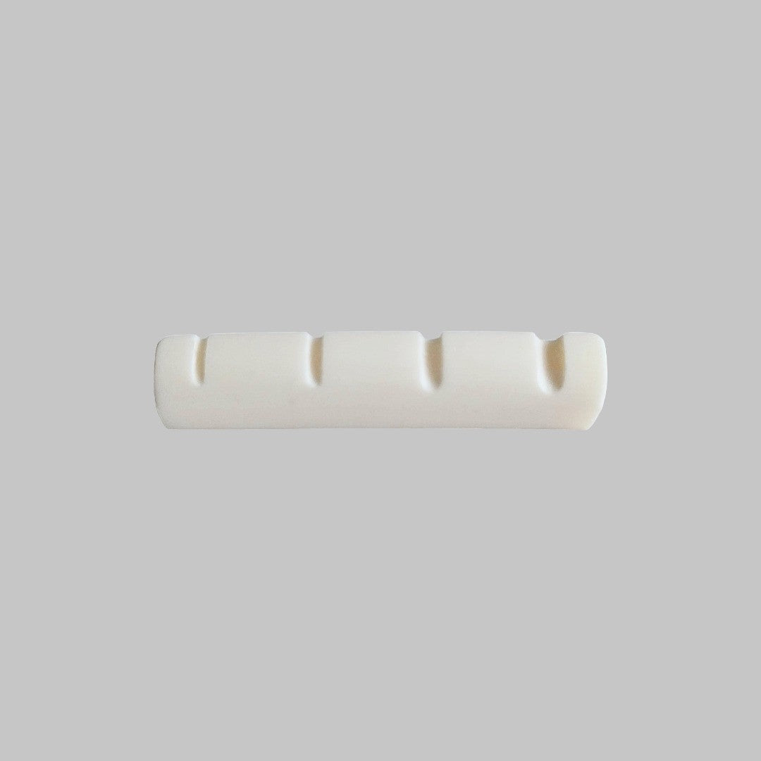 Cejilla superior para bajo eléctrico de 4 cuerdas marca Memphis, material hueso