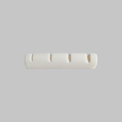 Cejilla superior para bajo eléctrico de 4 cuerdas marca Memphis, material hueso