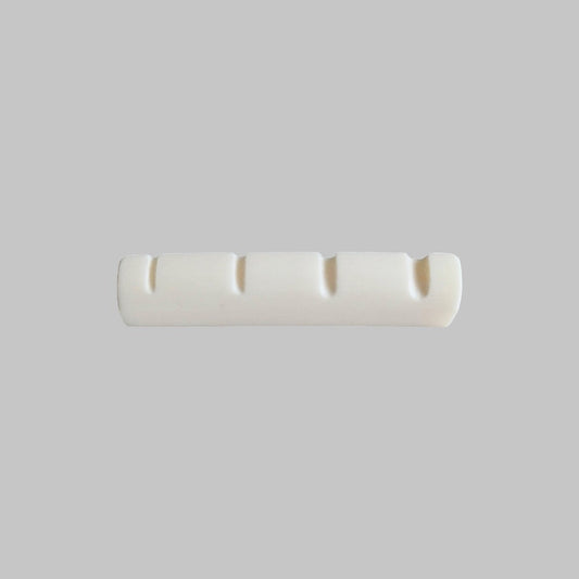 Cejilla superior para bajo eléctrico de 4 cuerdas marca Memphis, material hueso