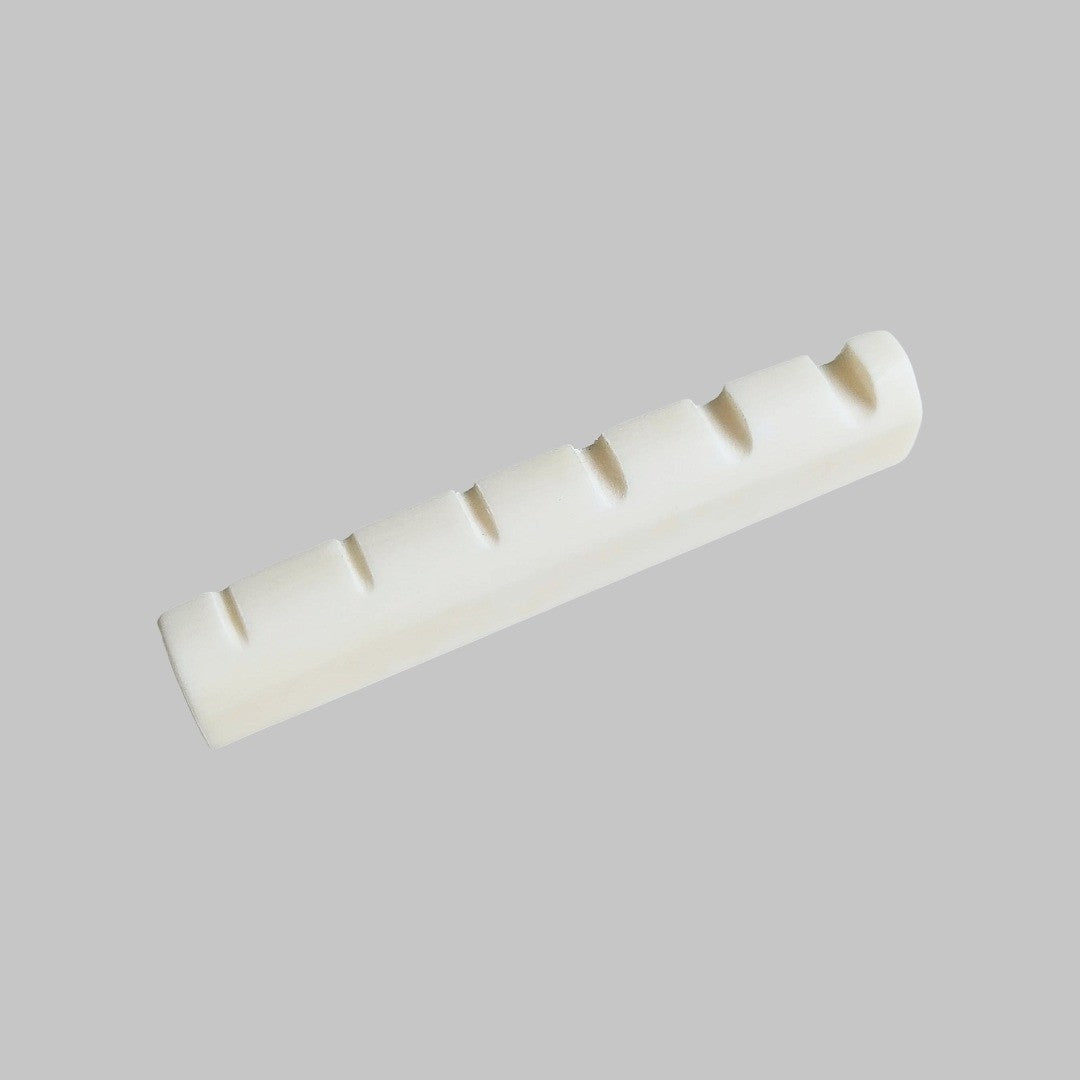 Cejilla superior para bajo eléctrico de 6 cuerdas marca Memphis, material hueso