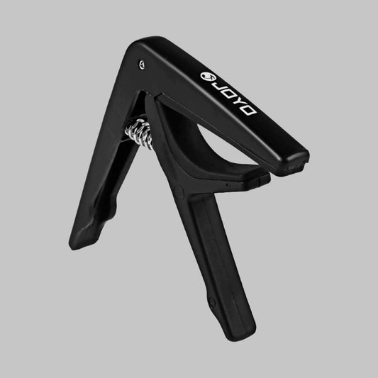 Capodastro para guitarra marca Joyo, color negro