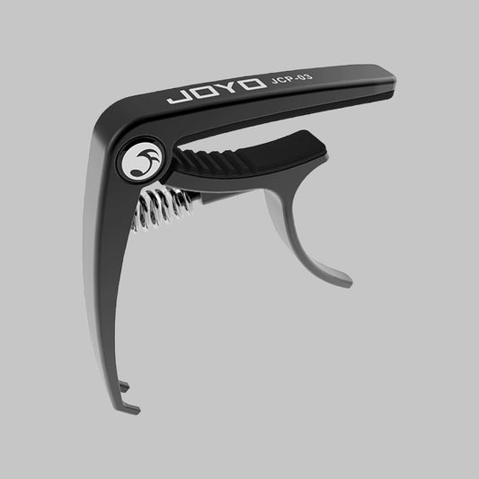 Capodastro para guitarra marca Joyo, color negro